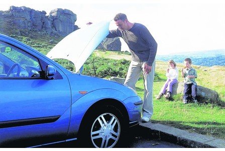 Man looking under car bonnet